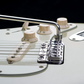 close up of chrome vegatrem bridge on guitar bridge