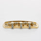 halon US-spec offset bridge w/ brass saddles back view gold