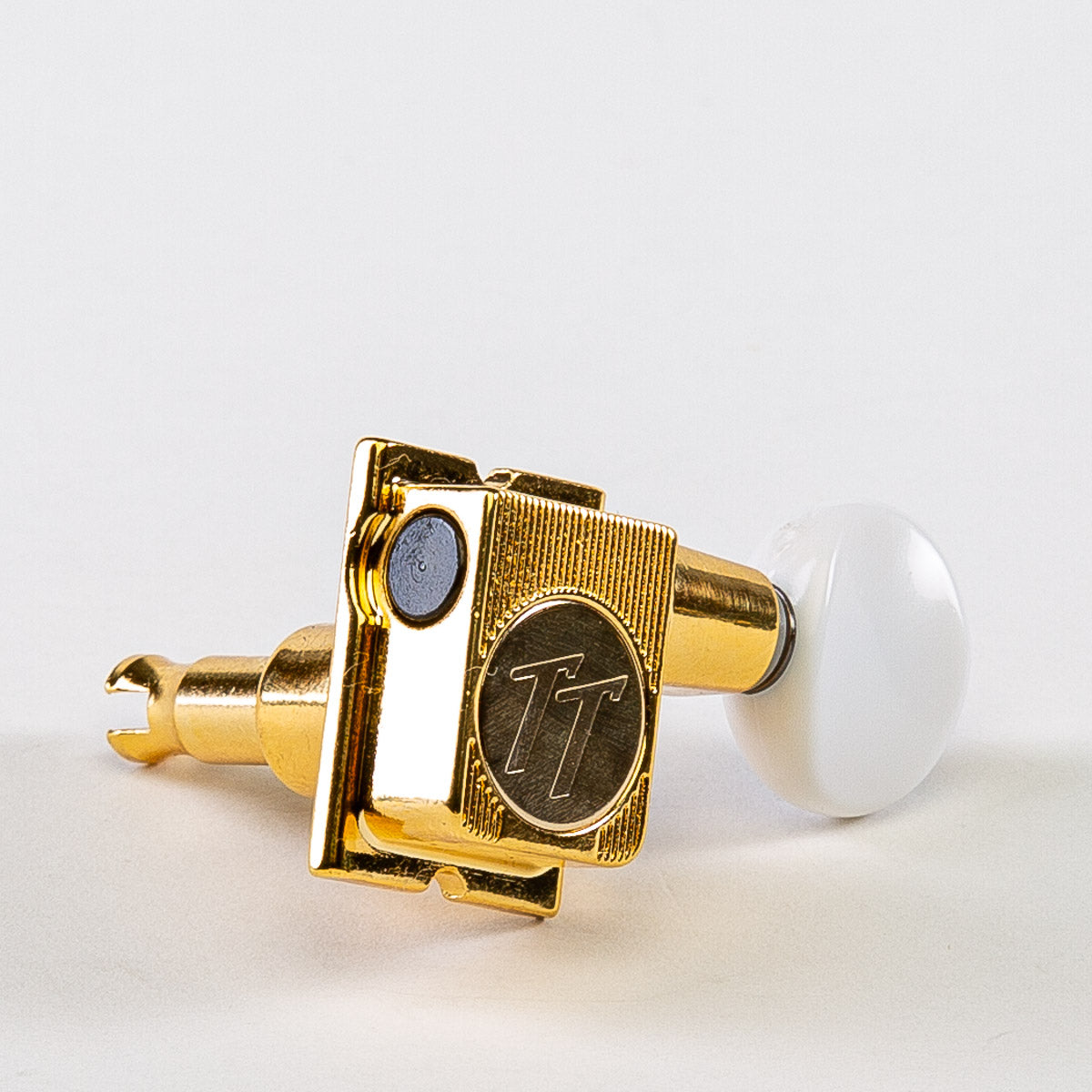 Allparts Top Tier 6 in-line keys w/ white plastic oval buttons single front view gold