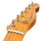 up close headstock of guitar at an angle